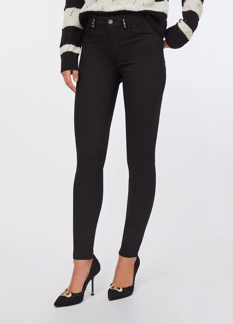 pantalon skinny orné de pierres précieuses