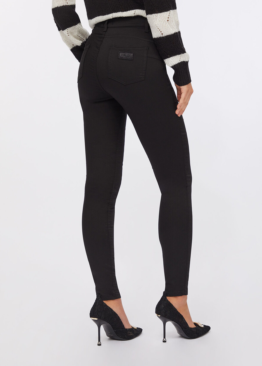 pantalon skinny orné de pierres précieuses